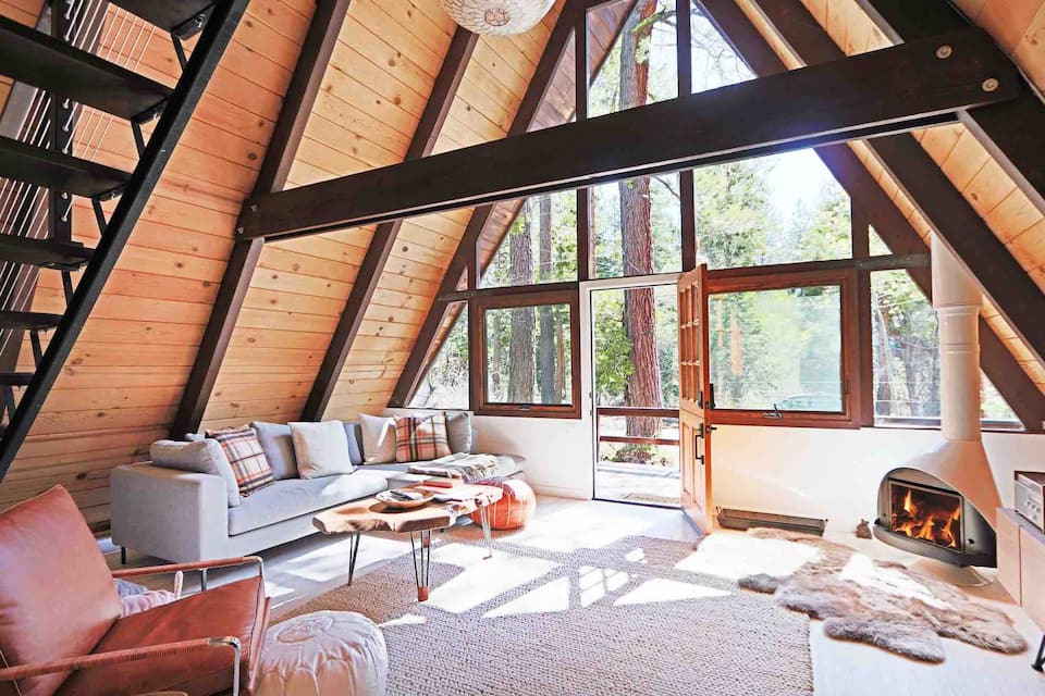 Mid Century Lake Tahoe Cabin living room with a fireplace