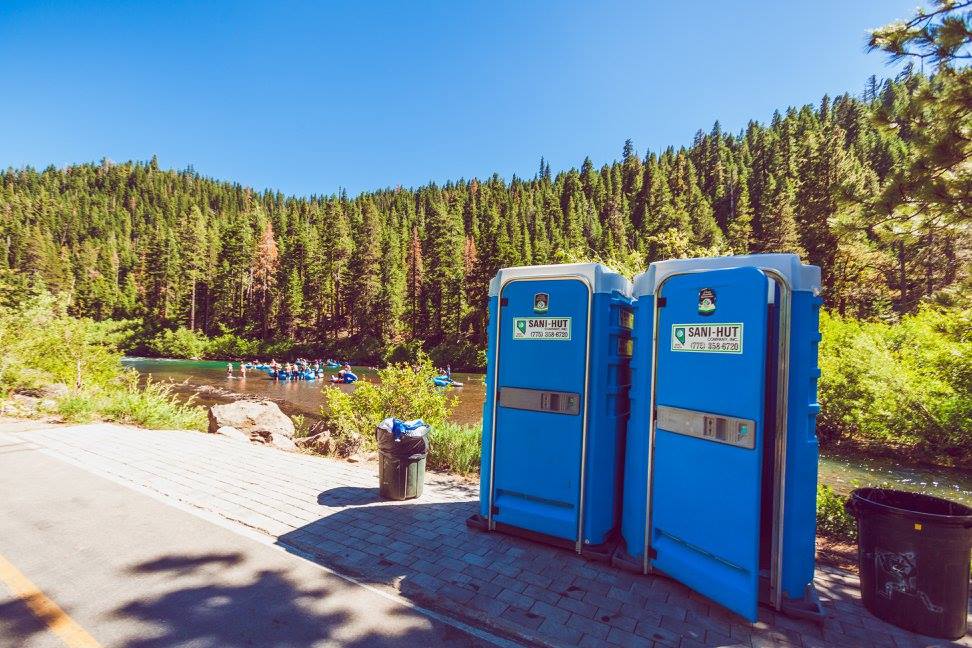 Portable restrooms on the shores of the Truckee River