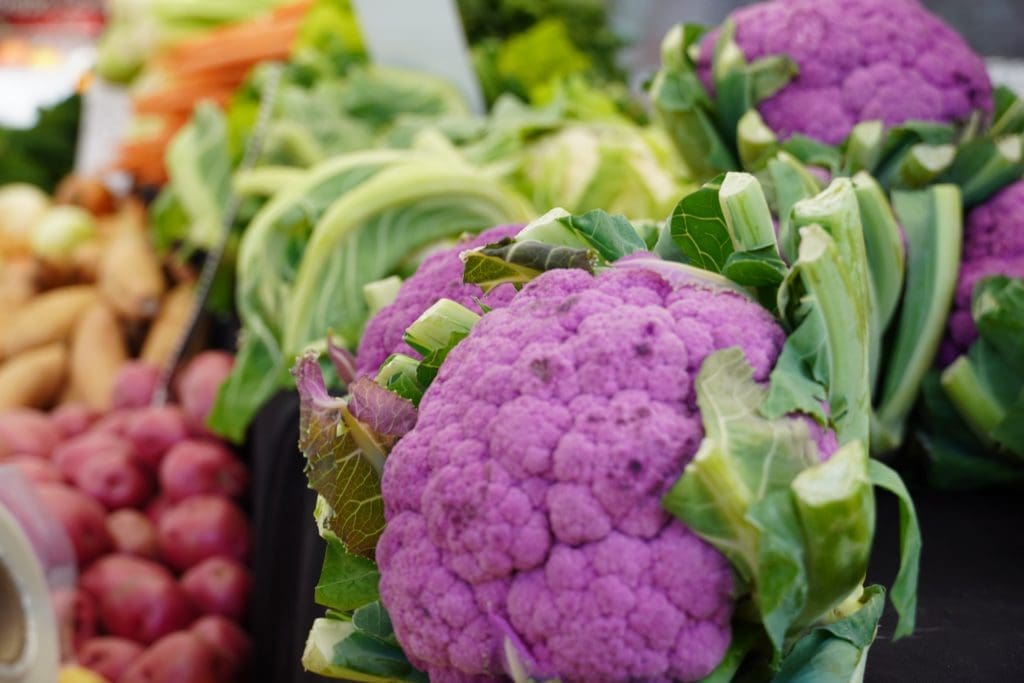 Purple cauliflower on a shelf