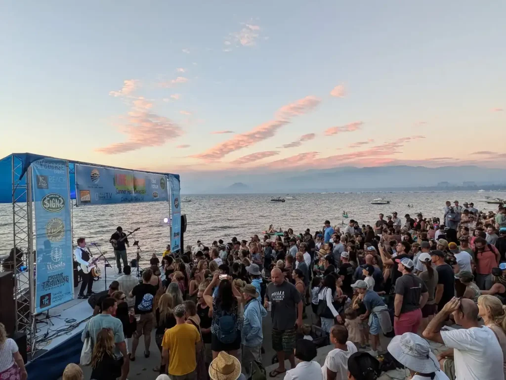 Crowd dancing to a summer concert with Lake Tahoe in the background. Live at lakeview concert series