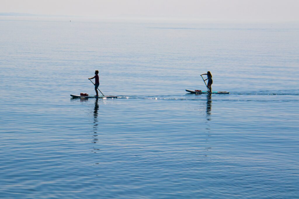 glassy water paddleboarding