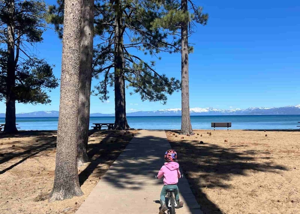 Kid riding down to the beach at Nevada BEach Campground